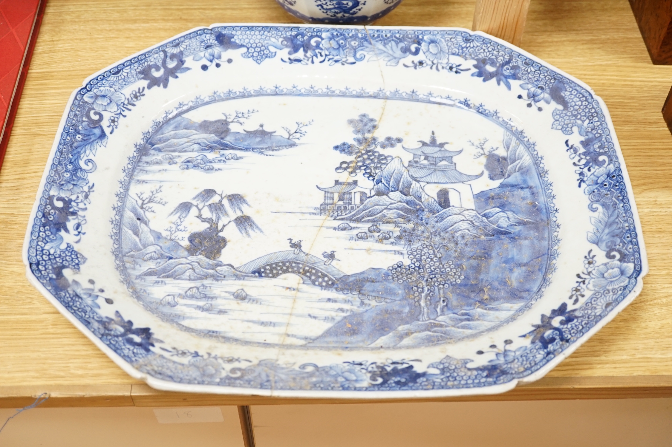 A group of 18th/19th century Chinese blue and white porcelain, including a Kangxi figure painted jar, a large meat dish, a hexagonal dragon bowl, a dish and a teapot with lid (6), meat dish 46cm wide